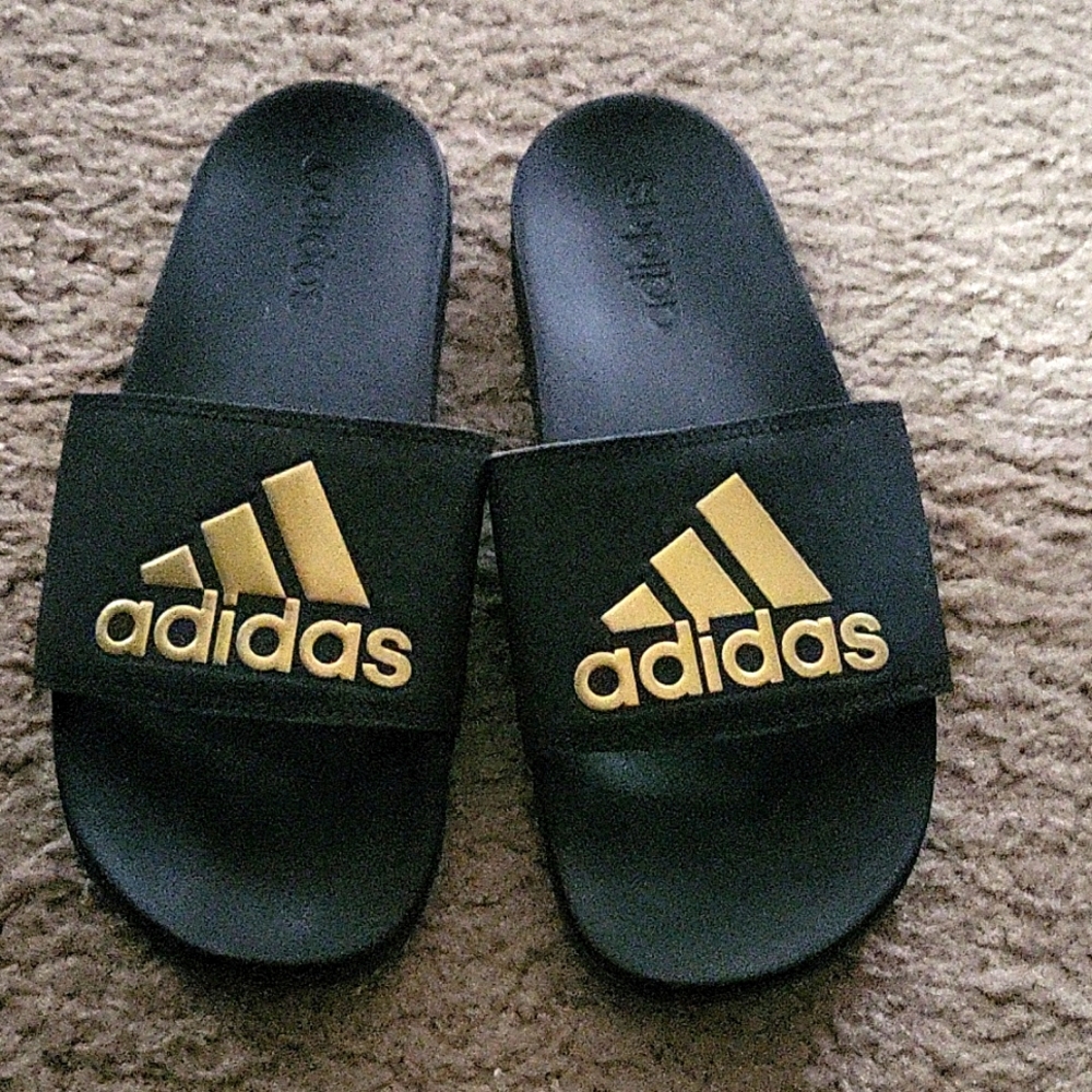 Adidas Black and gold slides